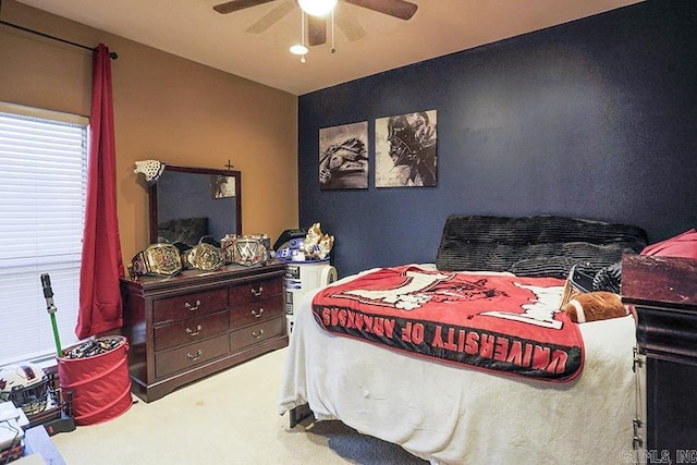 bedroom with ceiling fan and carpet