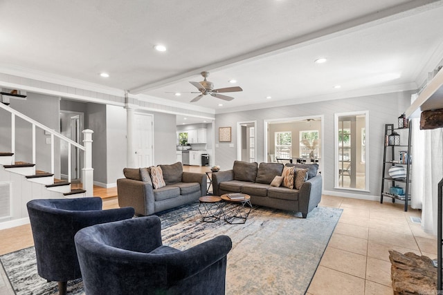 living room featuring beamed ceiling, ceiling fan, light tile patterned floors, and crown molding