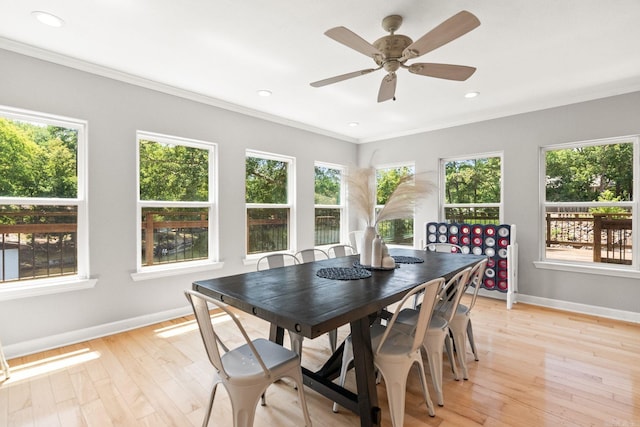 sunroom featuring ceiling fan