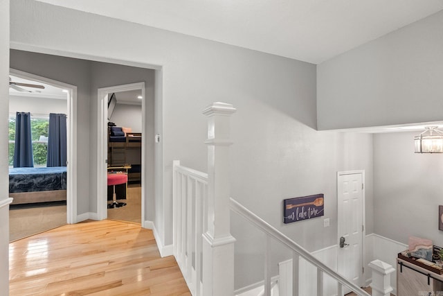 corridor with a notable chandelier and hardwood / wood-style flooring