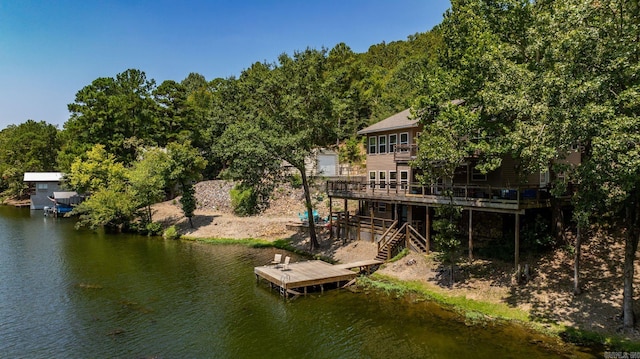 view of dock featuring a deck with water view