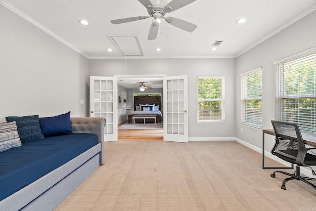 office with ceiling fan, french doors, crown molding, and light carpet