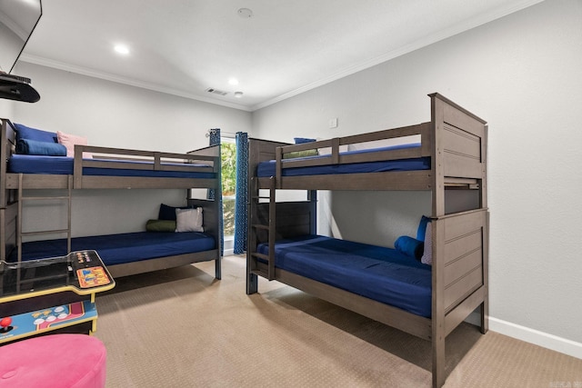 bedroom with carpet floors and crown molding