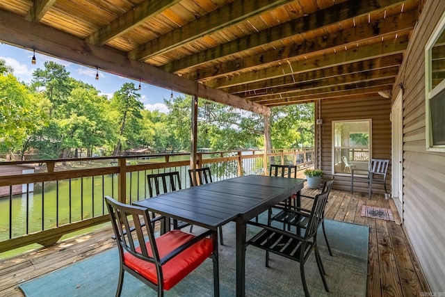 wooden deck with a lawn