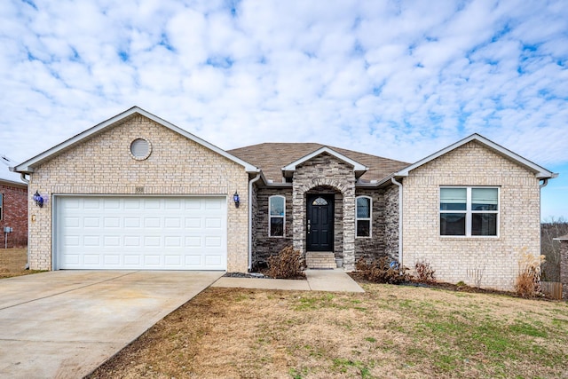 view of front of property with a garage and a front lawn