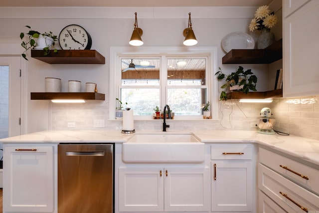 kitchen with white cabinets, backsplash, and sink