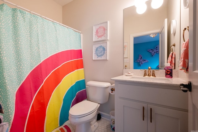 bathroom featuring toilet and vanity