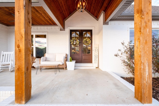 view of exterior entry featuring french doors