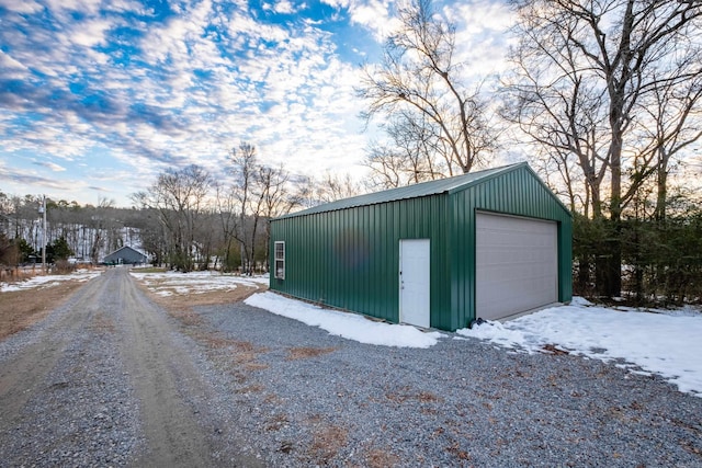 view of snow covered garage