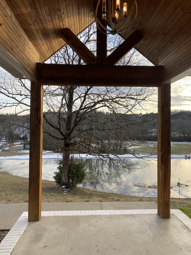 view of patio with a water view