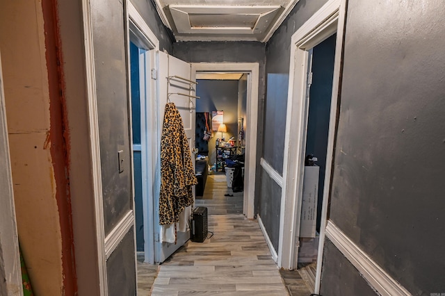 corridor with light hardwood / wood-style flooring