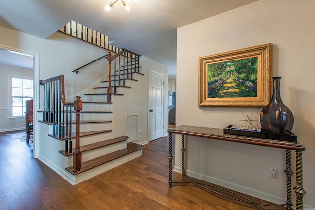 staircase featuring hardwood / wood-style flooring