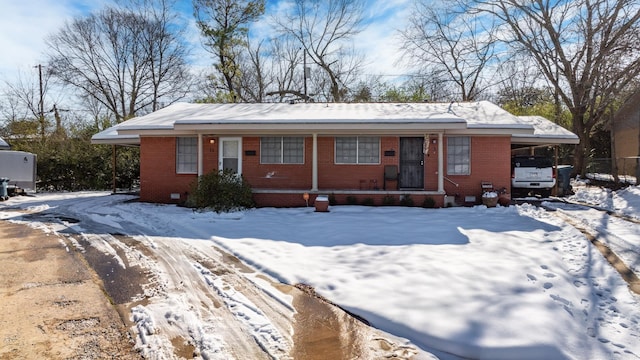 single story home featuring a carport