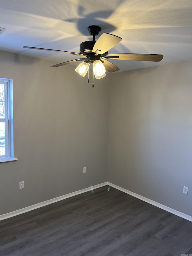 unfurnished room featuring ceiling fan and dark hardwood / wood-style floors