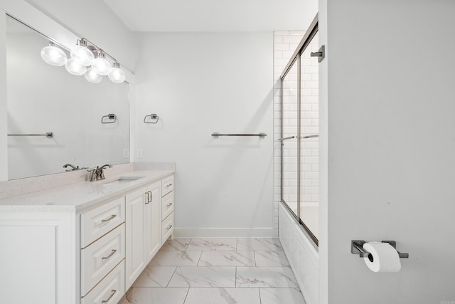 bathroom with vanity and enclosed tub / shower combo