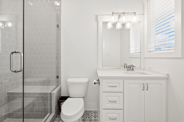 bathroom featuring toilet, an enclosed shower, tile patterned floors, and vanity