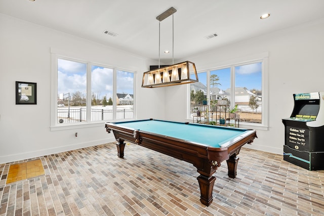 game room featuring light hardwood / wood-style floors, pool table, and plenty of natural light