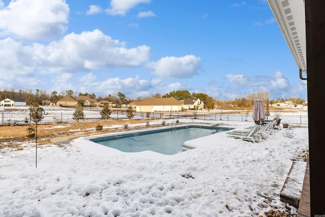 view of snow covered pool