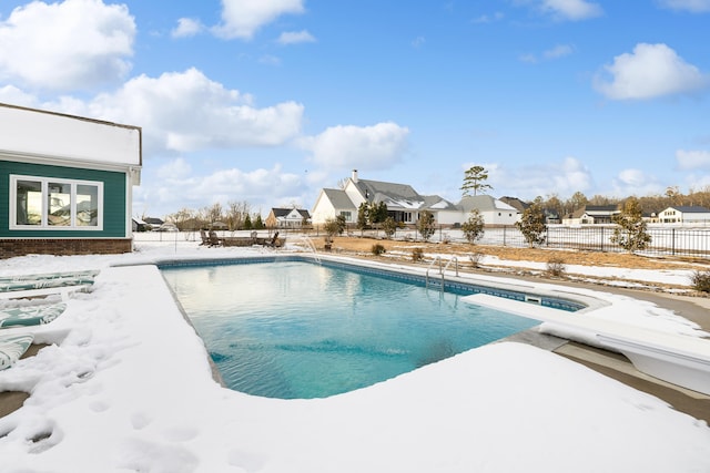 snow covered pool with a diving board