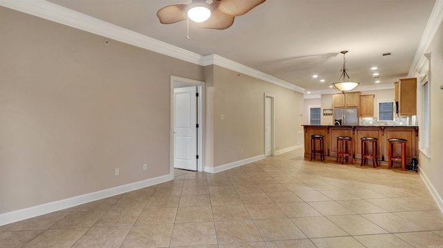 kitchen with crown molding, stainless steel fridge with ice dispenser, and light tile patterned floors