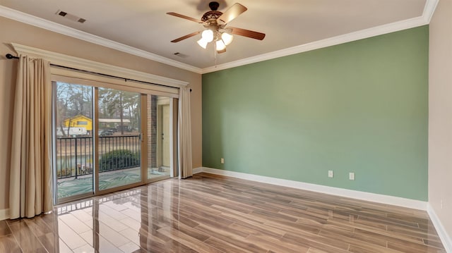 unfurnished room featuring wood-type flooring, ceiling fan, and crown molding