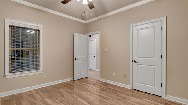 unfurnished bedroom with ceiling fan, ornamental molding, and light hardwood / wood-style flooring