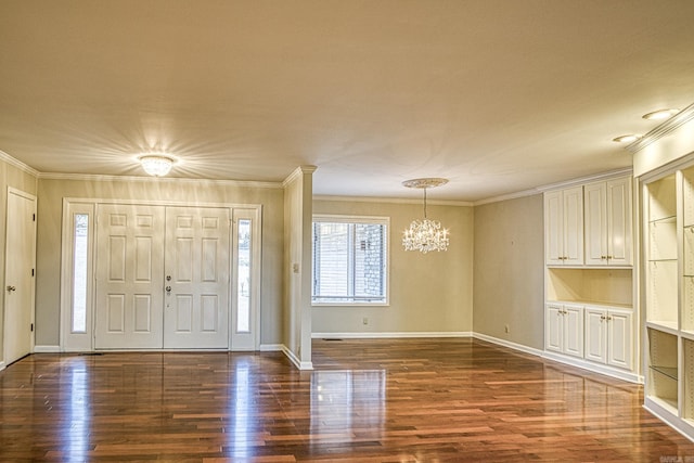 entryway featuring dark hardwood / wood-style flooring, an inviting chandelier, and crown molding