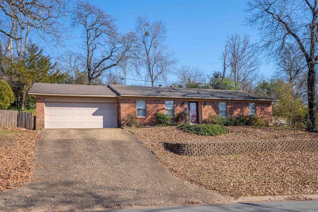 single story home with a garage