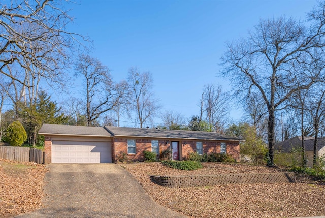 ranch-style home with a garage