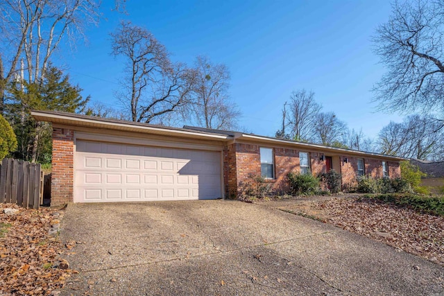 ranch-style home featuring a garage