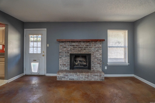 unfurnished living room with a brick fireplace and a textured ceiling