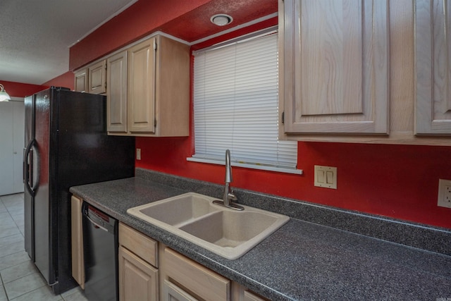 kitchen with light tile patterned flooring, light brown cabinetry, dishwasher, and sink