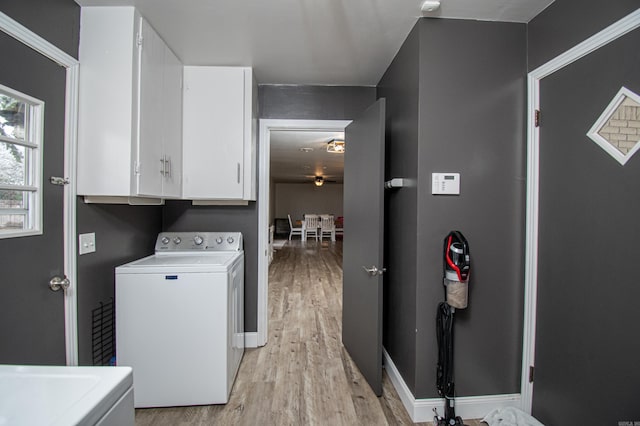 washroom featuring washing machine and dryer, light wood-type flooring, ceiling fan, and cabinets