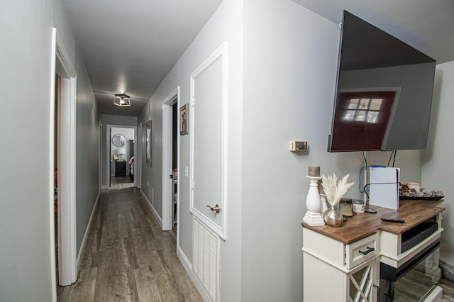 hallway featuring wood-type flooring