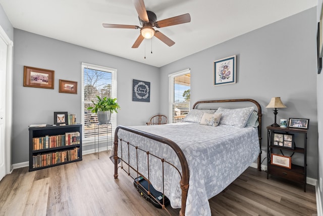 bedroom featuring ceiling fan and wood-type flooring