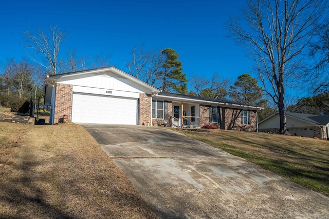 single story home featuring a front yard and a garage