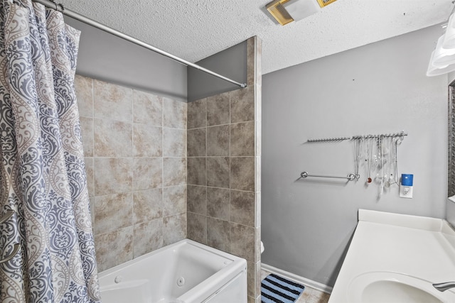 bathroom featuring sink, a textured ceiling, and shower / tub combo with curtain