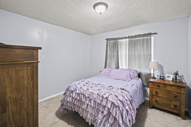 carpeted bedroom with a textured ceiling