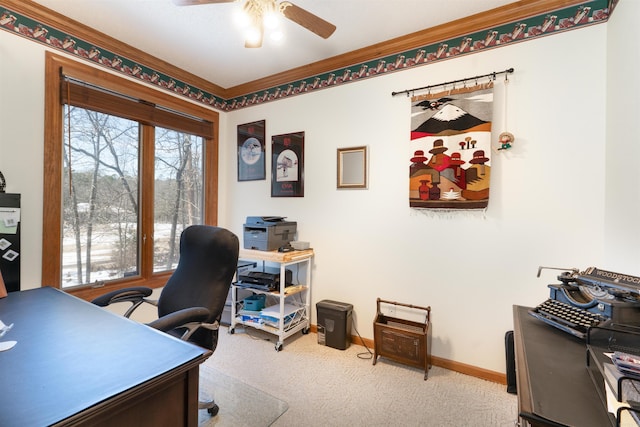 carpeted office space with ceiling fan and crown molding