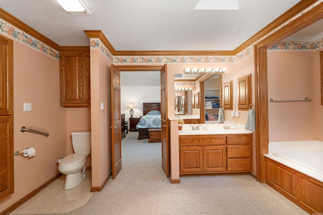 bathroom featuring a textured ceiling, ornamental molding, toilet, a washtub, and vanity