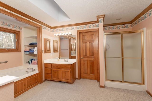 bathroom featuring a textured ceiling, plus walk in shower, and vanity