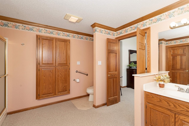 bathroom with a textured ceiling, an enclosed shower, vanity, and toilet