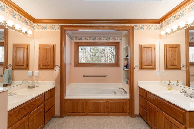 bathroom with vanity, a tub to relax in, and ornamental molding