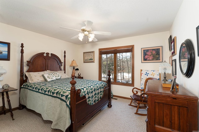 bedroom with ceiling fan and light carpet