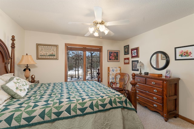 bedroom with ceiling fan, light carpet, a textured ceiling, and access to exterior