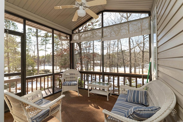 sunroom featuring ceiling fan and lofted ceiling