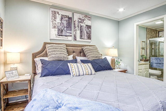 bedroom featuring ornamental molding and ensuite bathroom