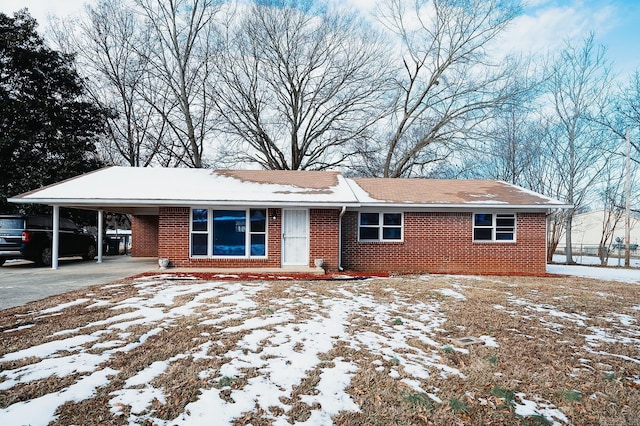 single story home featuring a carport