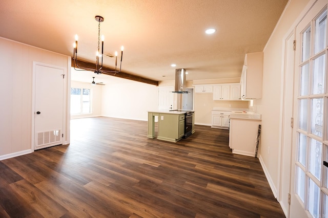 kitchen featuring decorative light fixtures, a center island, white cabinetry, range hood, and dark wood-type flooring