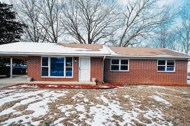 single story home featuring a carport